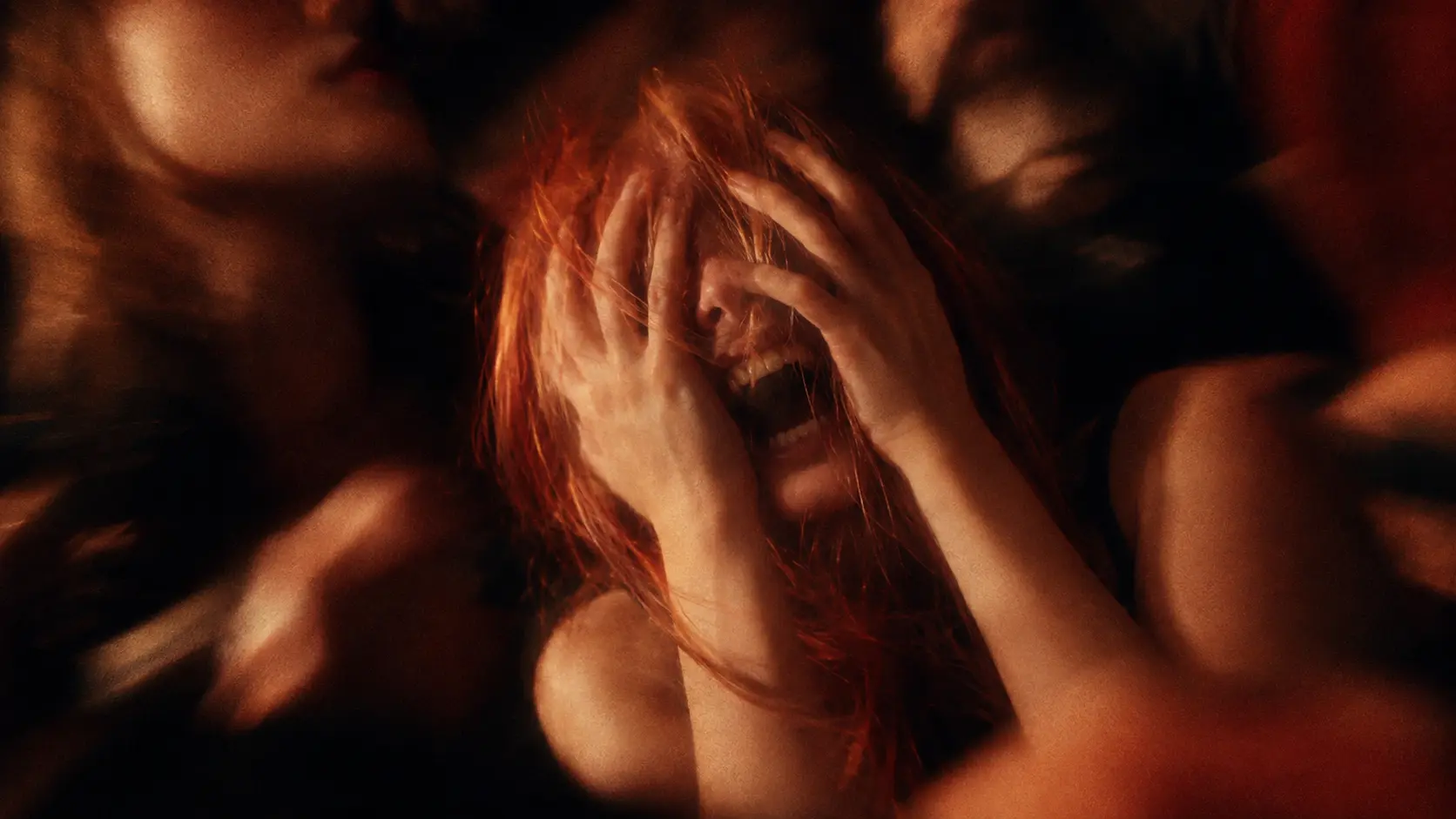 Blurred figure screaming in red light