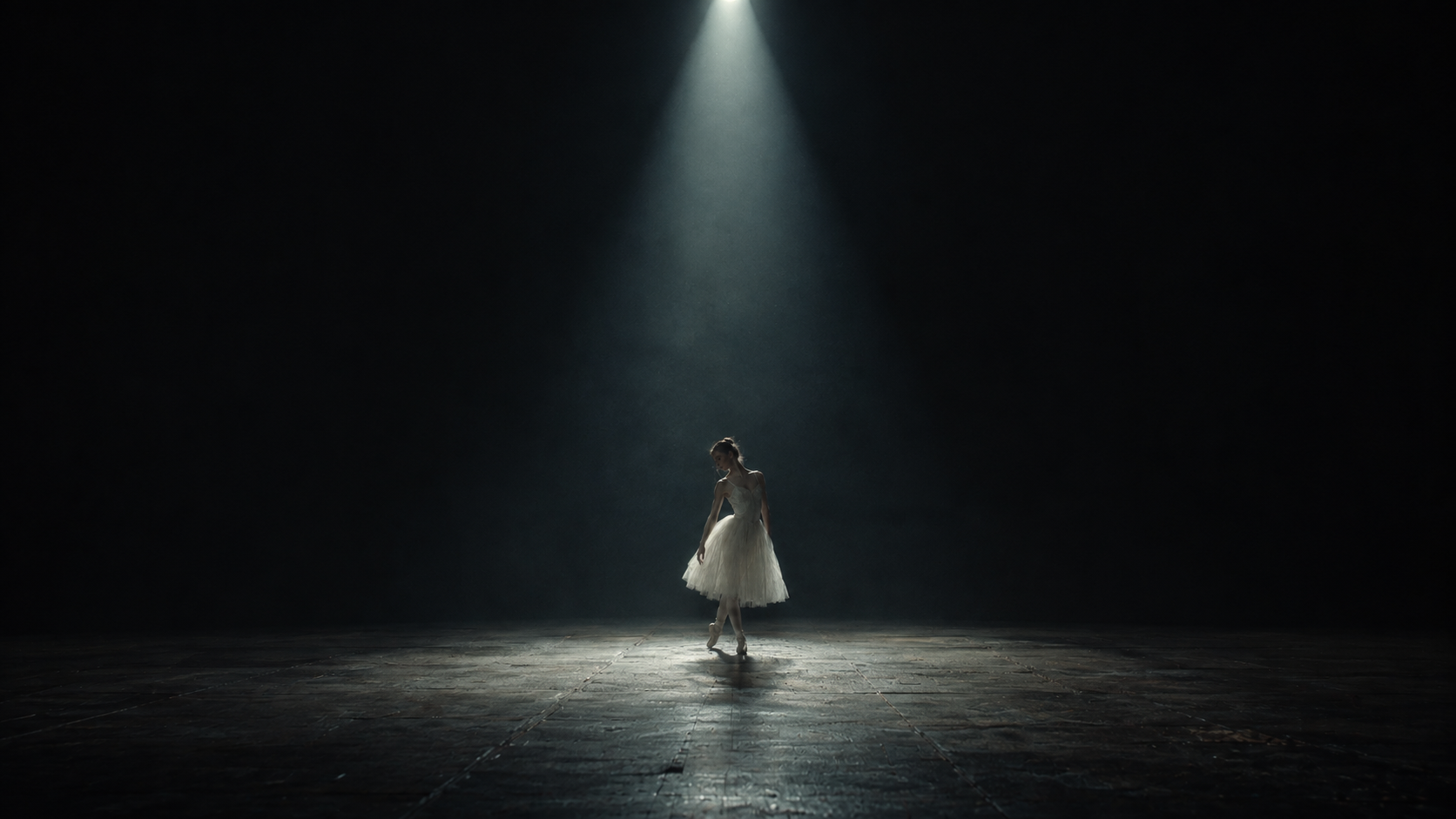 Ballerina alone in a spotlight