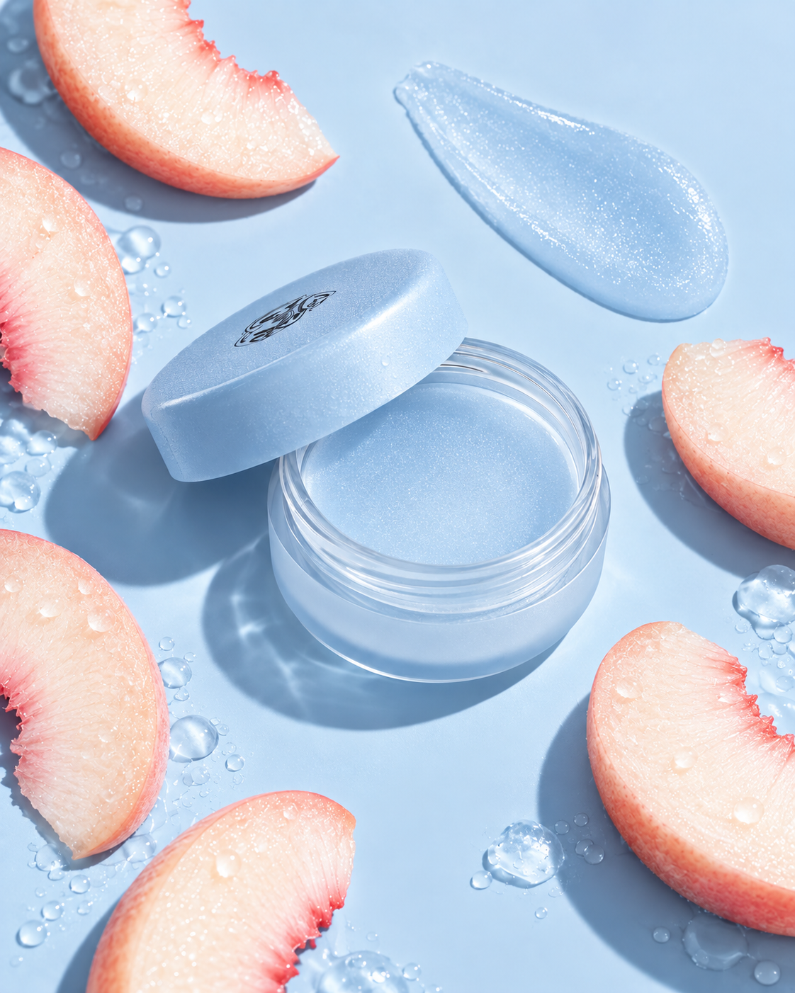 Open blue lip balm with glossy texture swatch