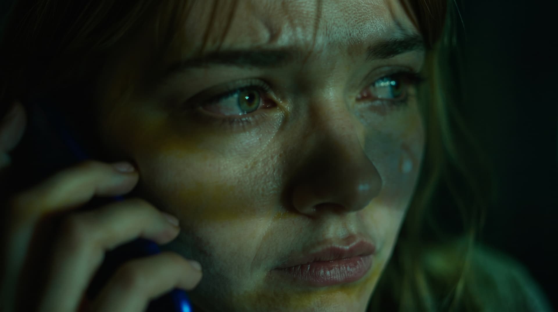 Close-up of tearful phone call